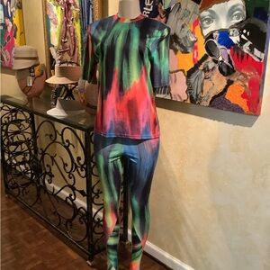 Colorful tee shirt with stirrup leggings.